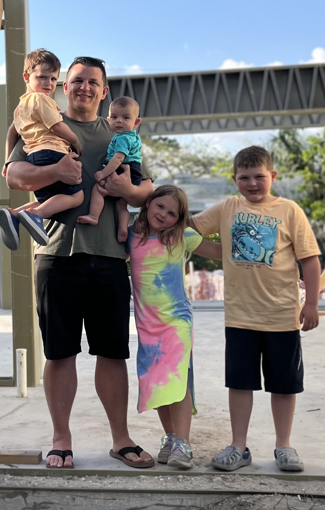Tony Frisone with his children outdoors